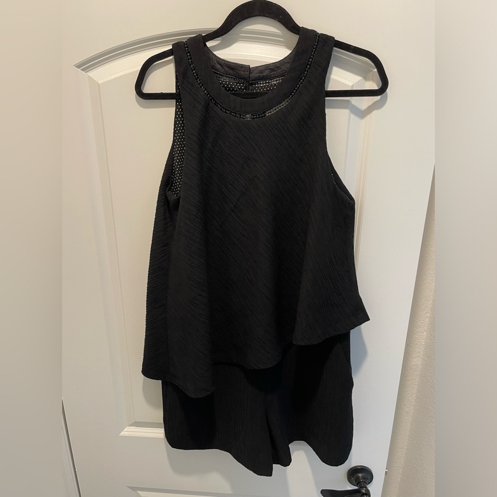 One piece culotte that is so flattering!  Side pockets and lined in polka dots.